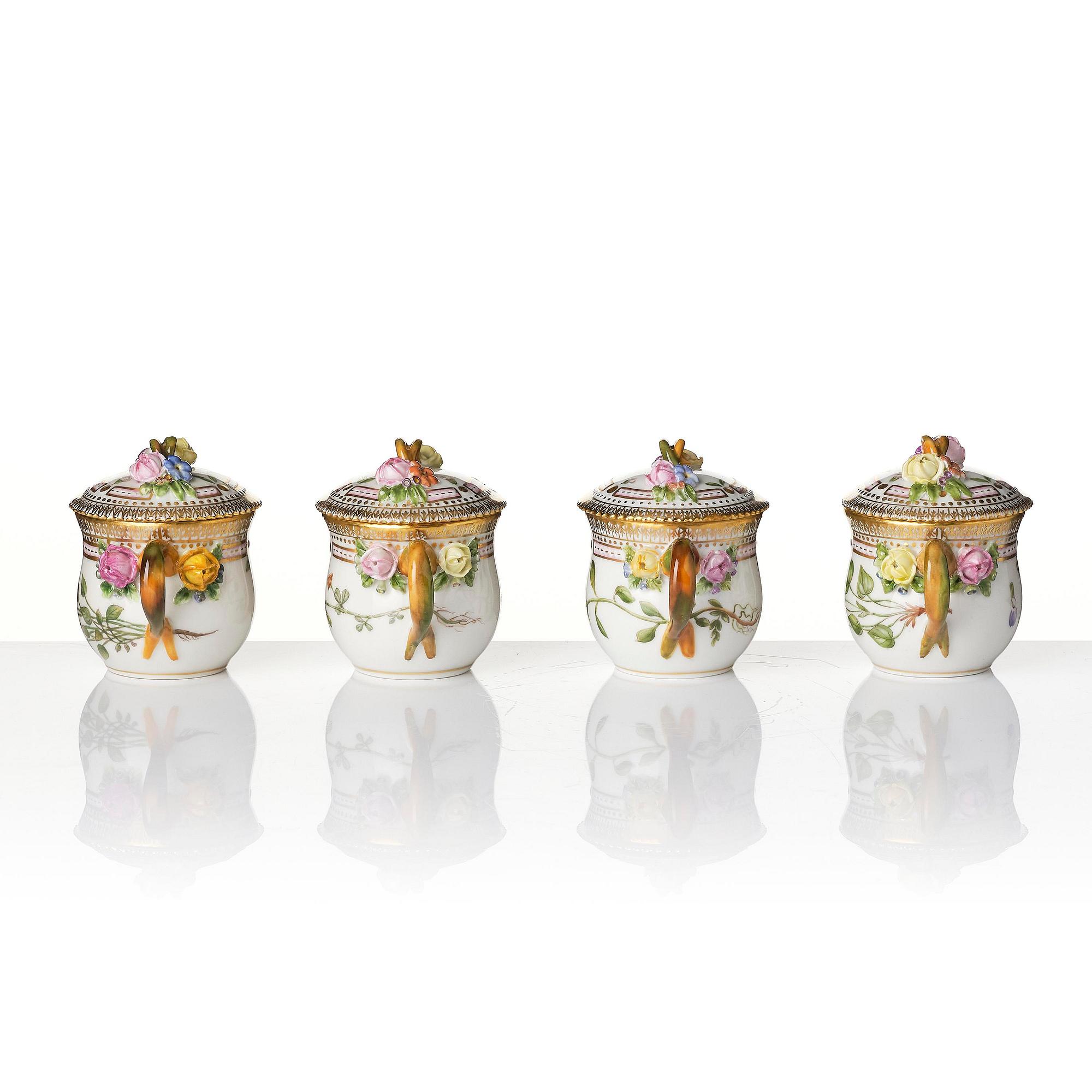 A set with four Royal Copenhagen 'Flora Danica' custard cups with covers and stands, Denmark, 20th century.
