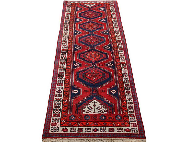 A runner carpet, Ardebil, c. 392 x 103 cm.