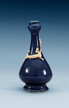 1552. A blue glazed vase with a qilin, Qing dynasty (1644-1912).