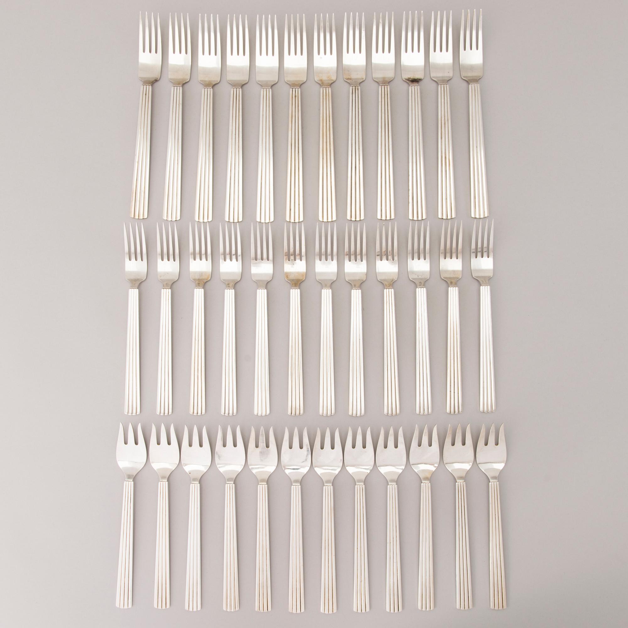 A 106 PIECE SILVER 'Bernadotte' cutlery set for George Jensen Denmark 1945-1977.