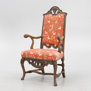 An oak baroque armchair from around the year 1700.