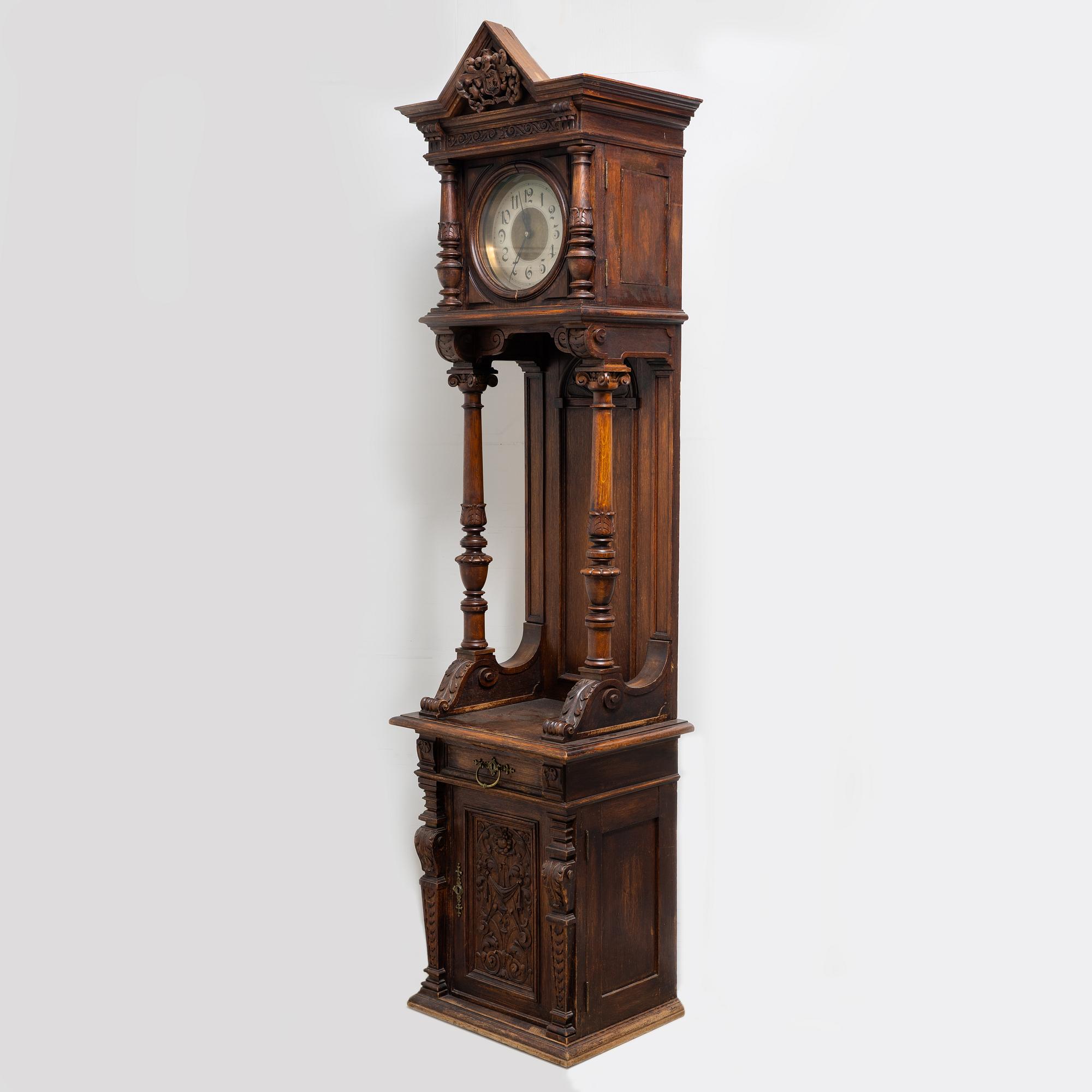 A long-case clock, late 19th century.