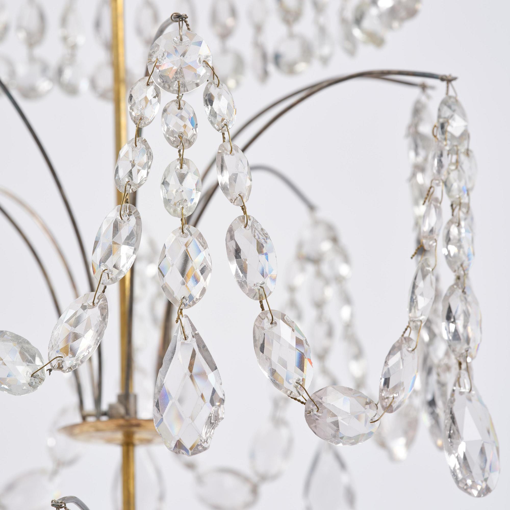 A late Gustavian gilt brass and cut glass eight-branch chandelier, Stockholm, late 18th century.