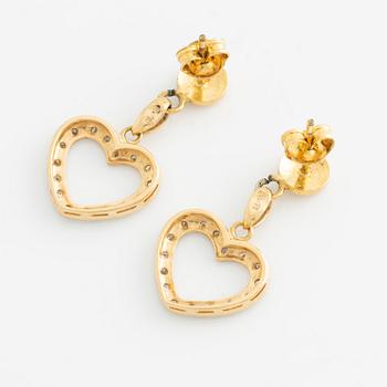 Earrings with hearts and small octagon-cut diamonds.
