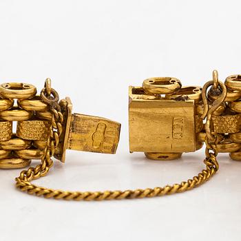 A 14K gold bracelet, Moscow, Russia.