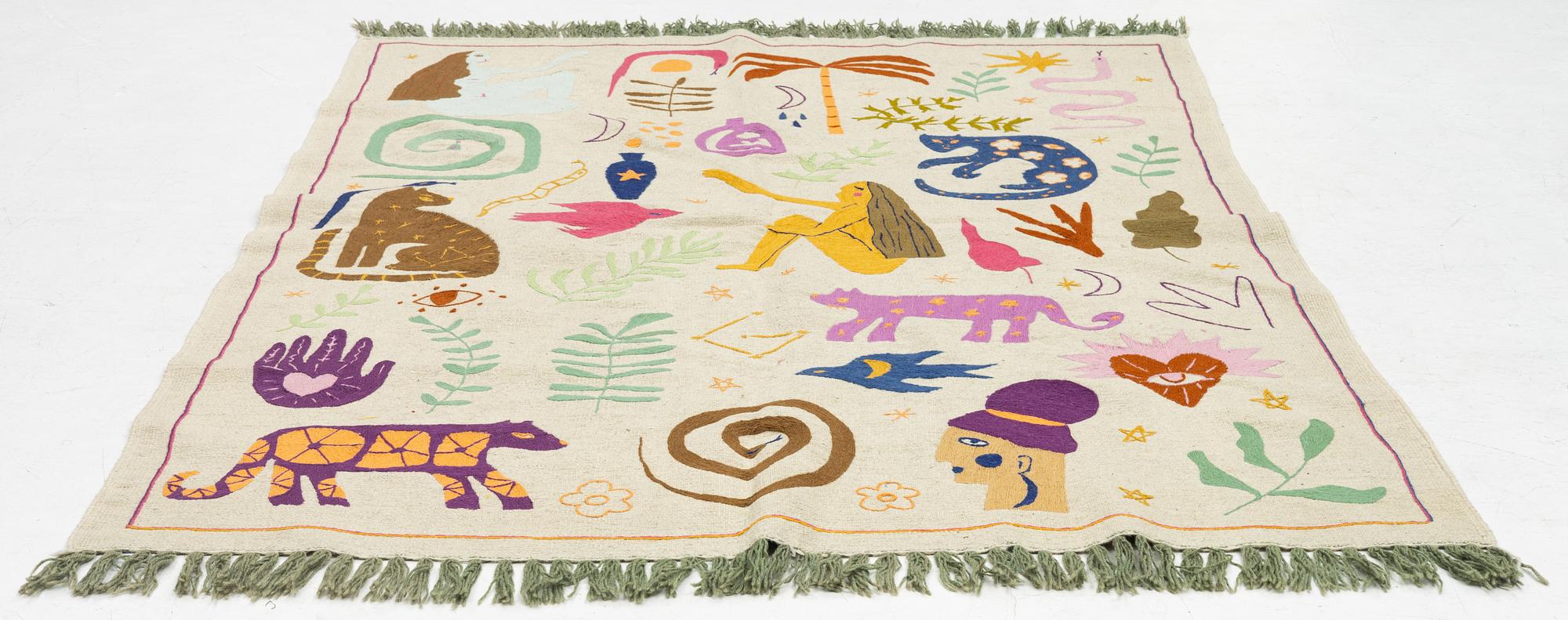 A hand-embroidered kilim carpet, c. 236 x 172 cm.