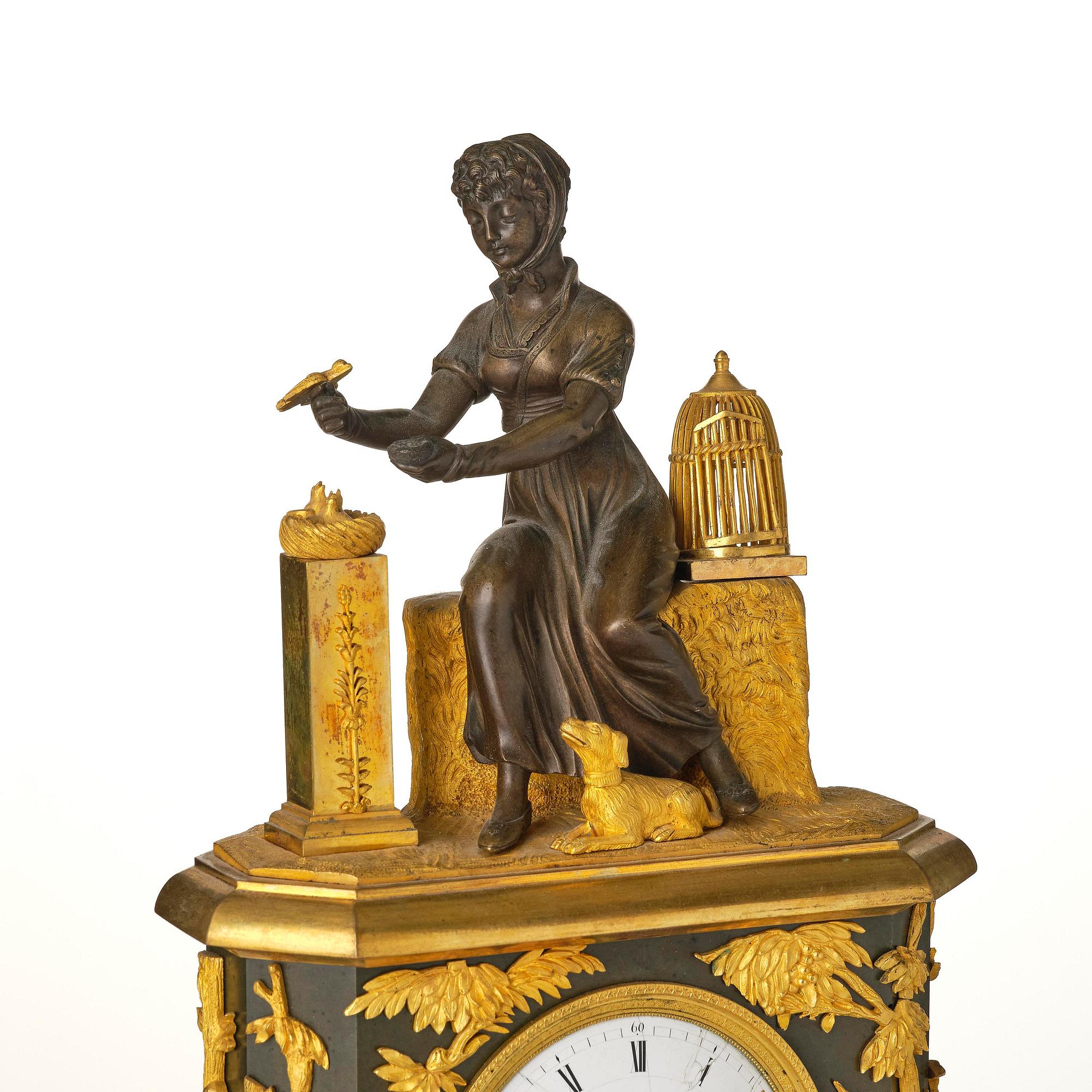 A French patinated and ormolu Directoire figural mantel clock, circa 1800.