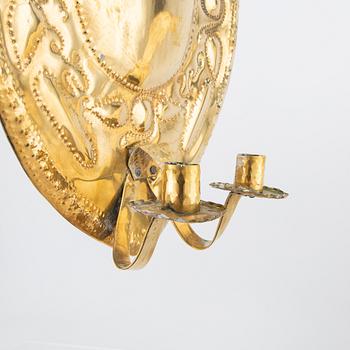 A pair of Baroque style brass wall scones around 1900.