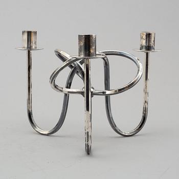 JOSEF FRANK, kandellaber, "Vänskapsknuten", försilvrad mässing. 2000-tal.