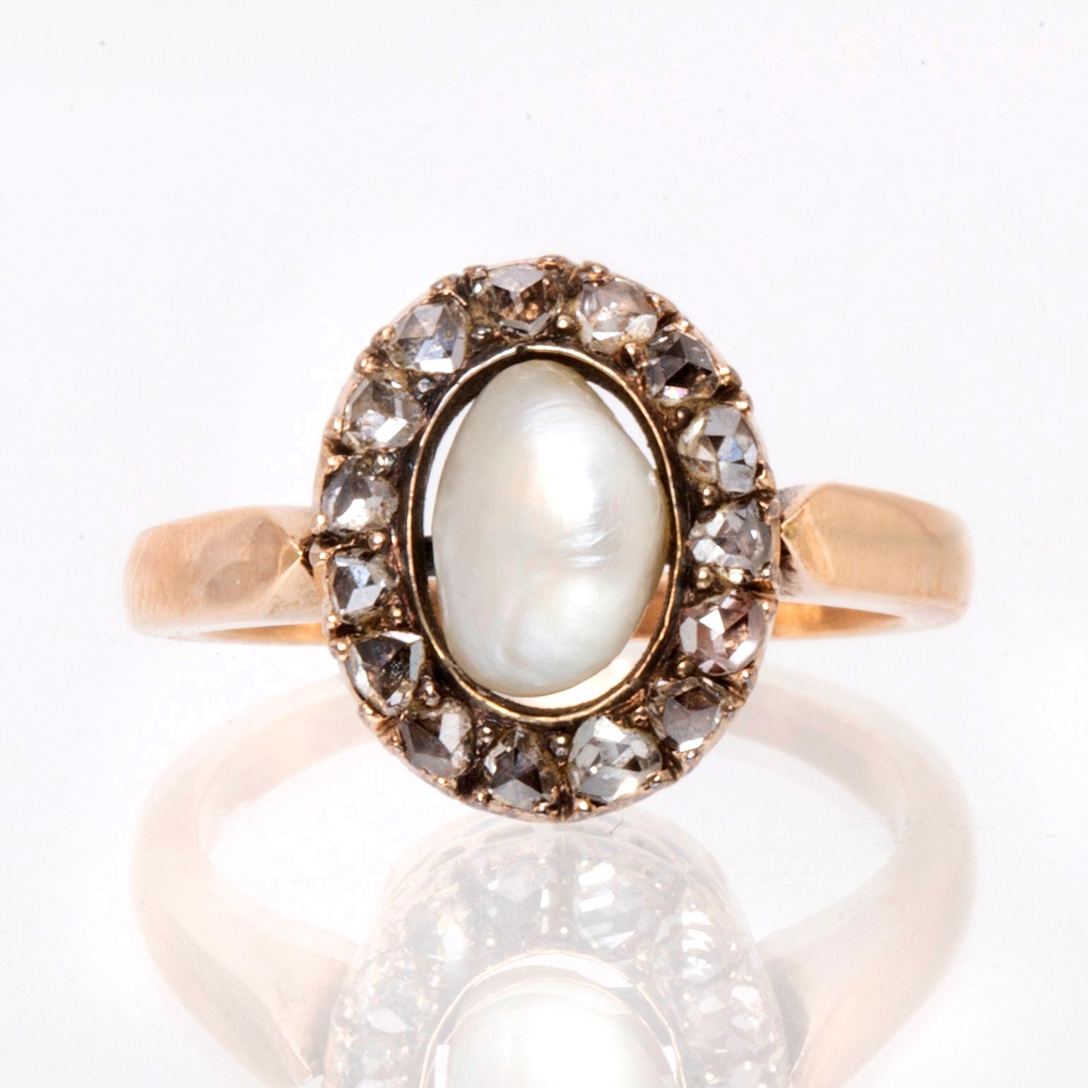 Ring 14K guld med 1 pärla ca 7 mm och rosenstenar.