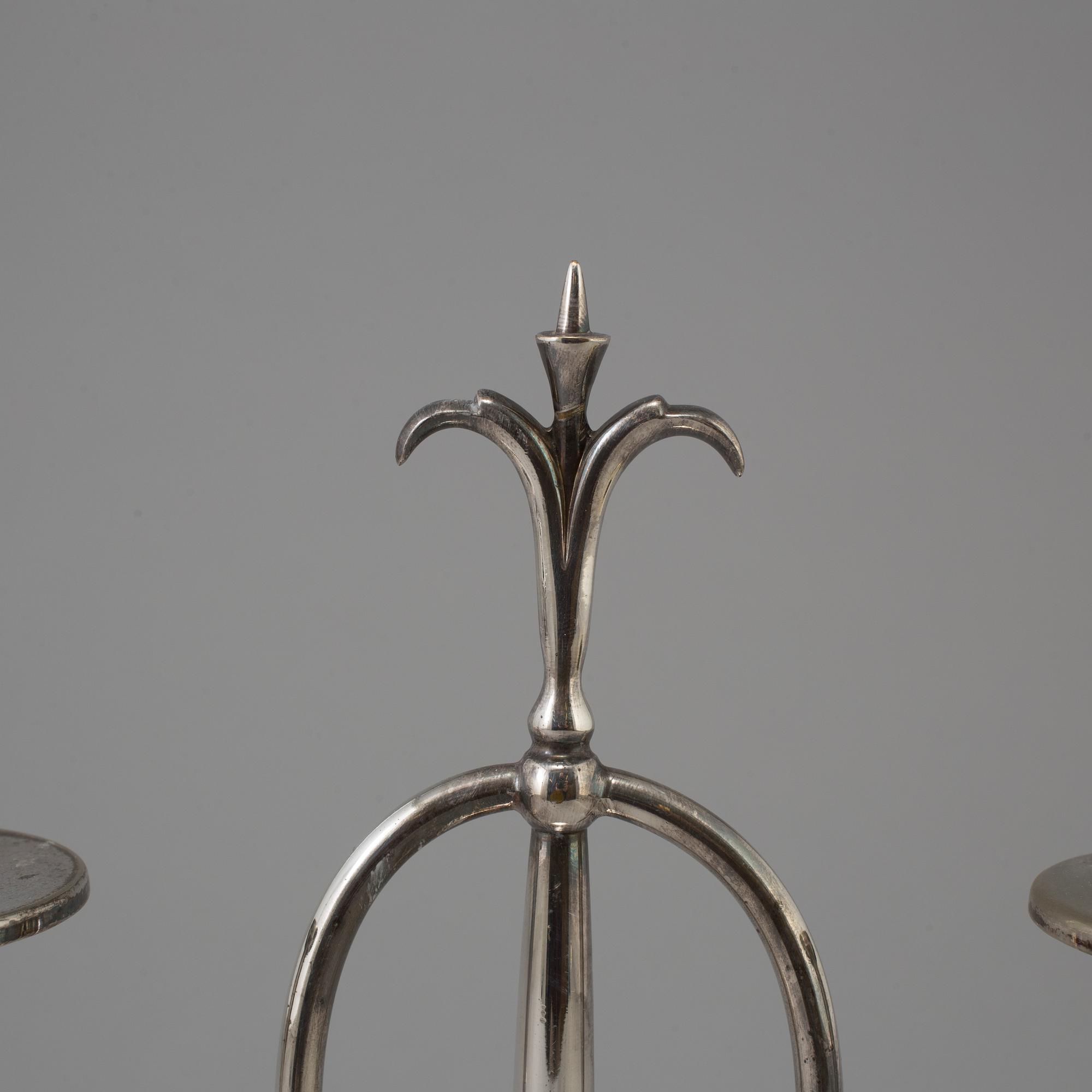 a pair of Elis Bergh silver plated candelabras, Swedish grace, CG Hallberg, Stockholm, 1920s.