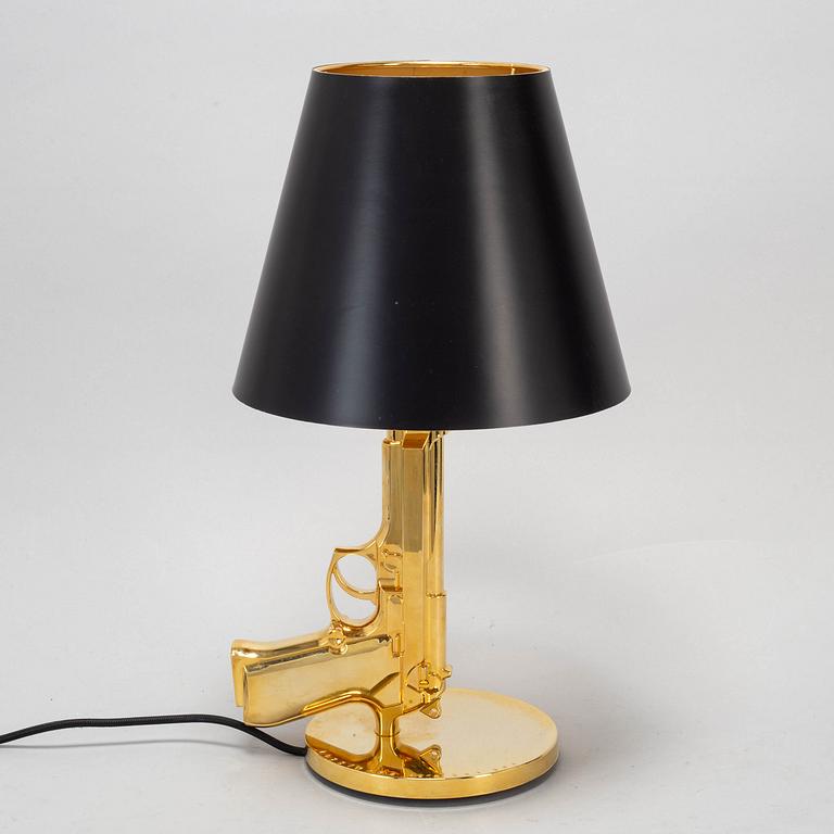 PHILIPPE STARCK, a 'Gun bedside Lamp', for Flos.