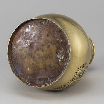 A 19th century brass champagne cooler.