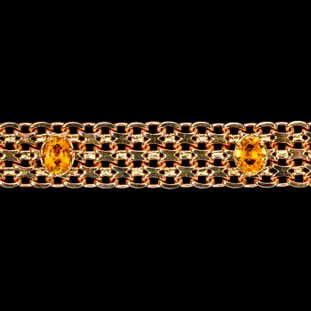 1193. BRACELET, gold and citrines. Weight 80 g.