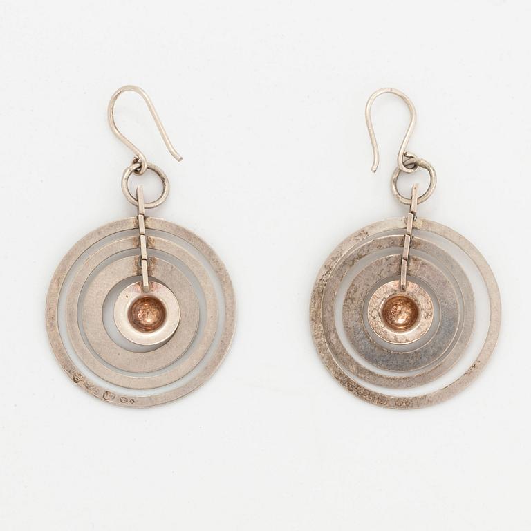 A pair of silver Tapio Wirkkala earrings.