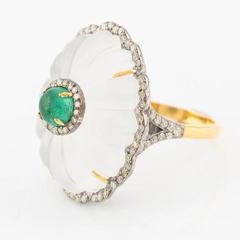 Ring with cut rock crystal, diamonds, and cabochon-cut emerald.