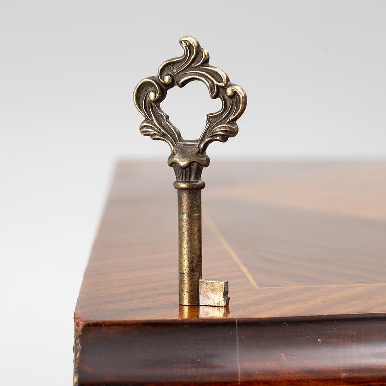 A Rococo style chest of drawers, mid-20th century.
