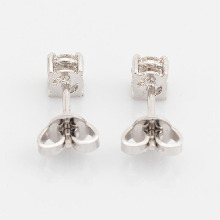 Brilliant cut diamond stud earrings.