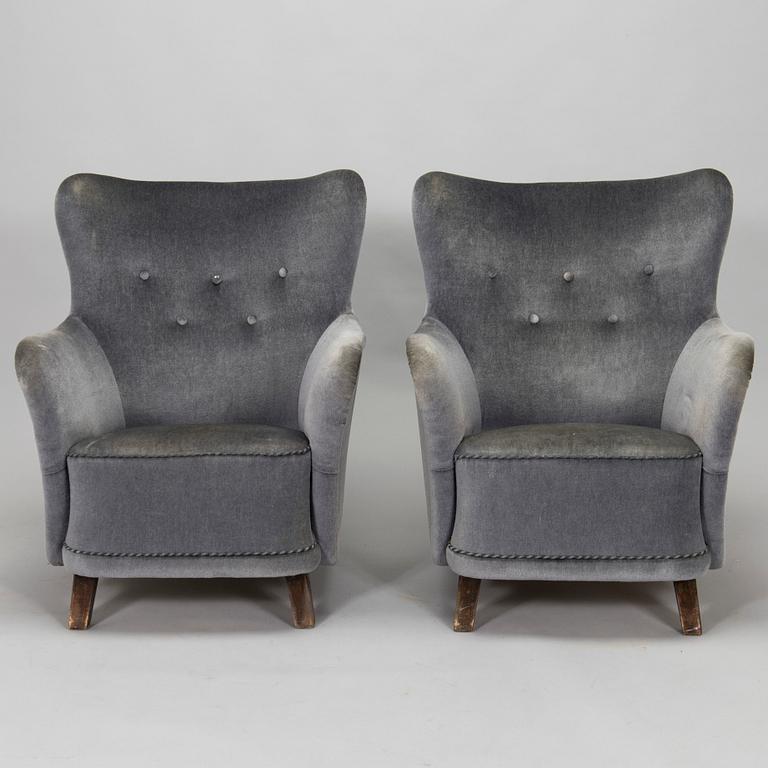 A pair of mid-20th century armchairs.