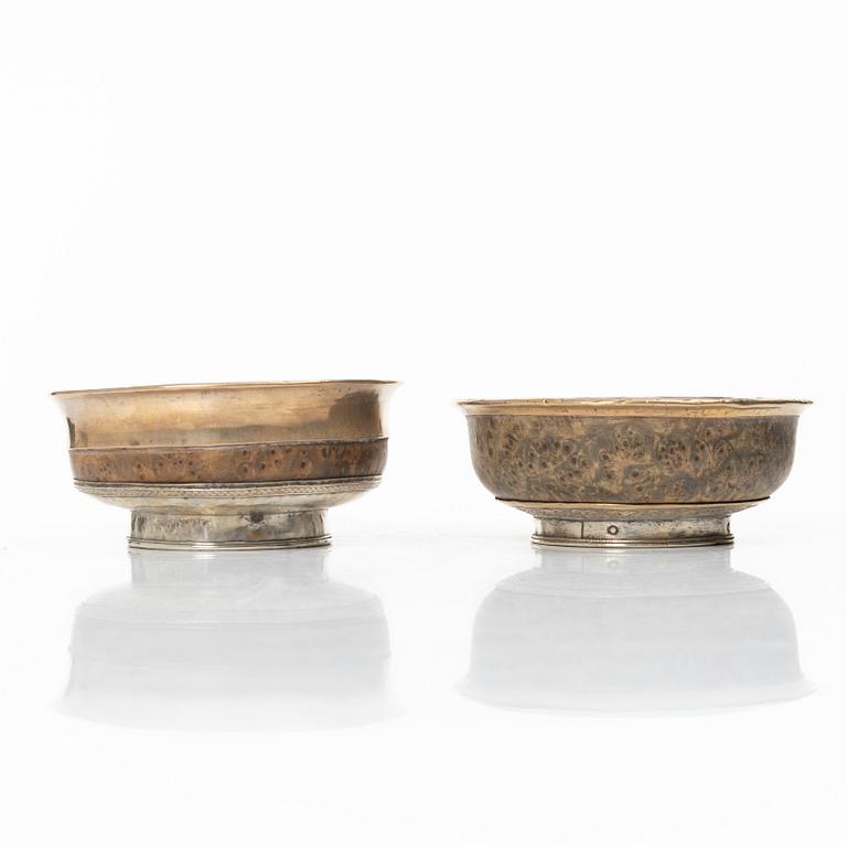 Two Tibetan bowls, low-grade silver and burl-wood, Early 20th century.