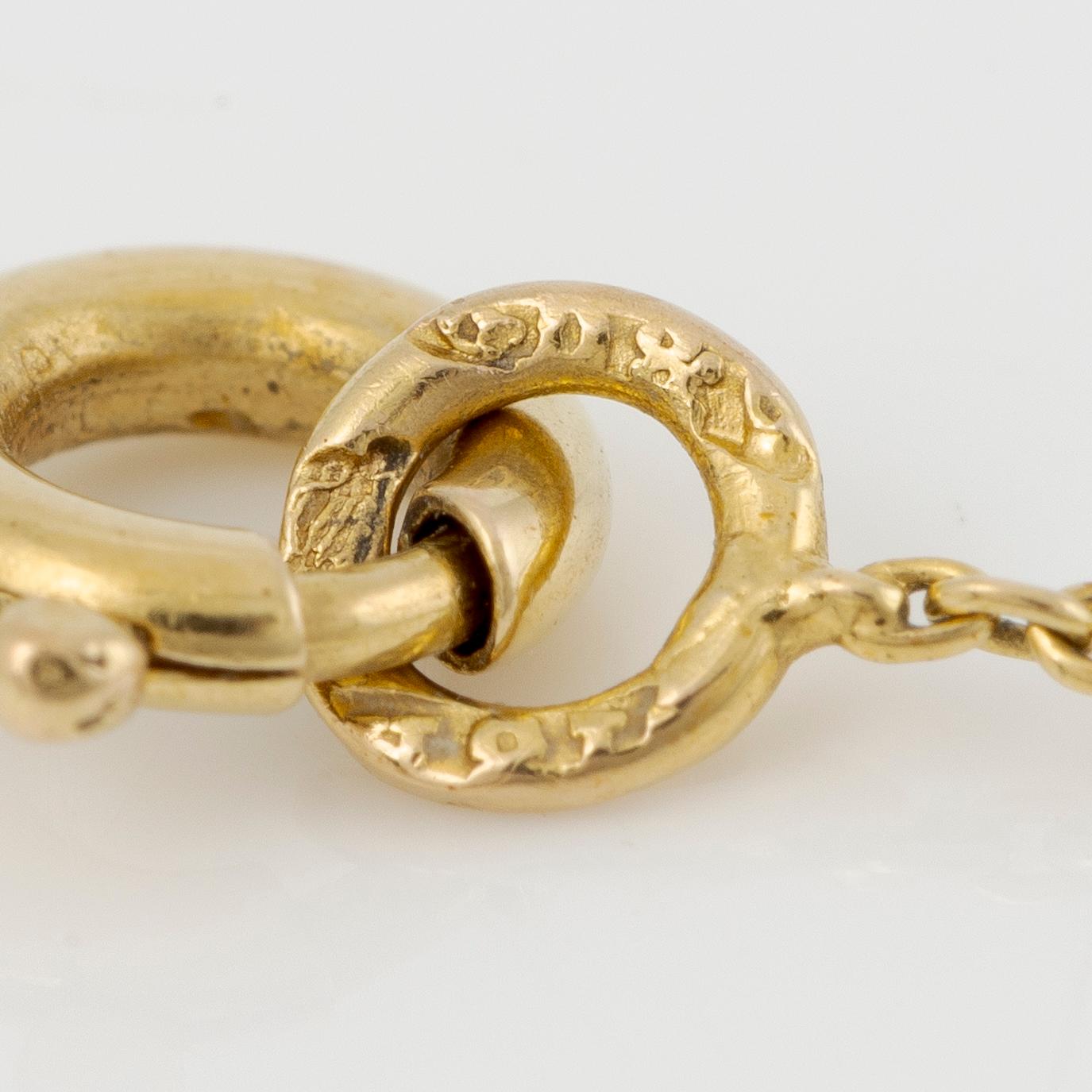 Necklace 18K gold and silver with a green stone and rose-cut diamonds.