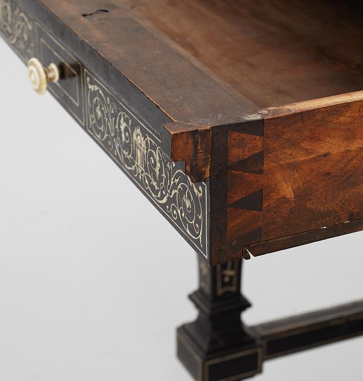 A Renaissance-style ebony, ebonized and ivory-inlaid library table, late 19th century, presumably Germany.