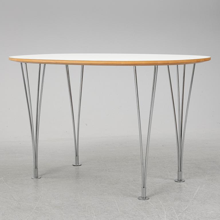 A 'Superellips" table by Bruno Mathsson & Piet Hein for Mathsson International darted 2011.