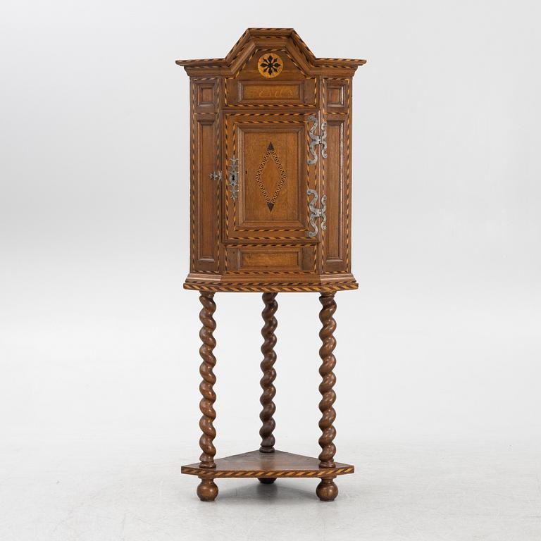 A corner cabinet, late 19th century.