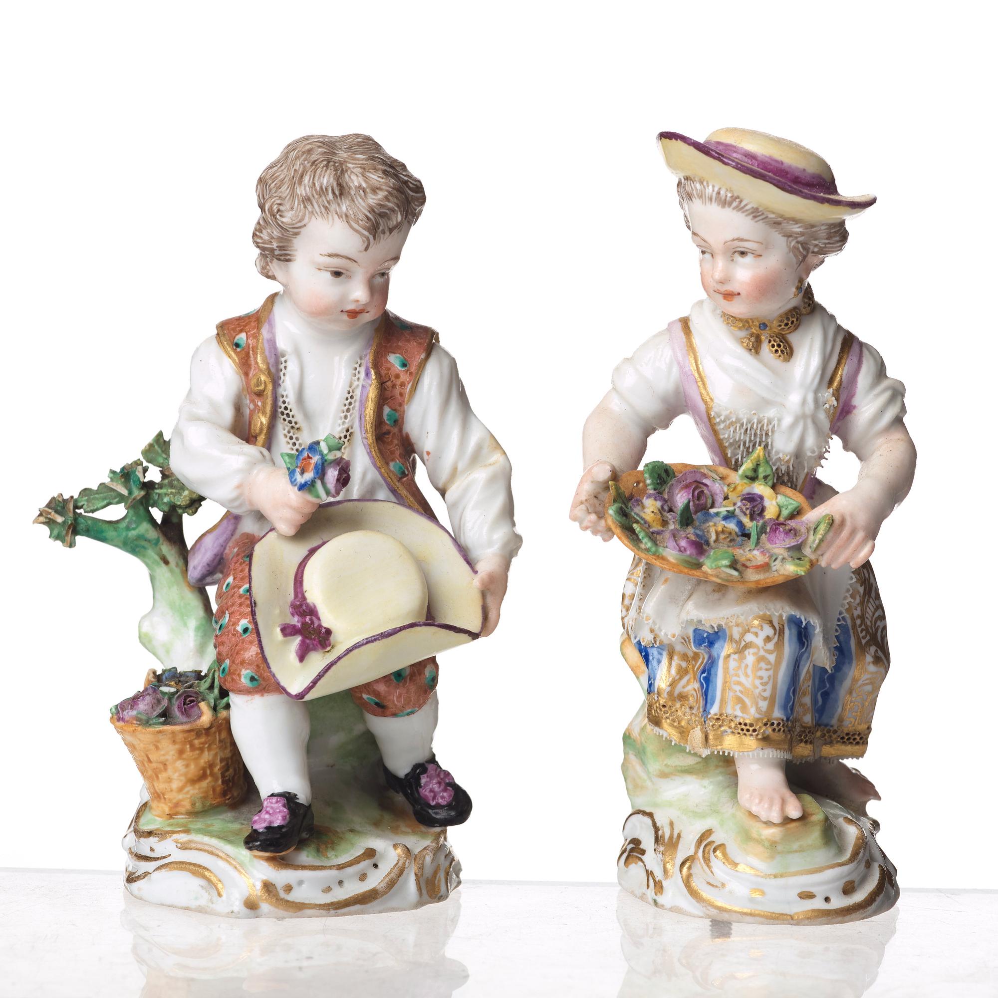 A pair of Meissen Rococo-style three-light candelabra, second half of the 1800's.