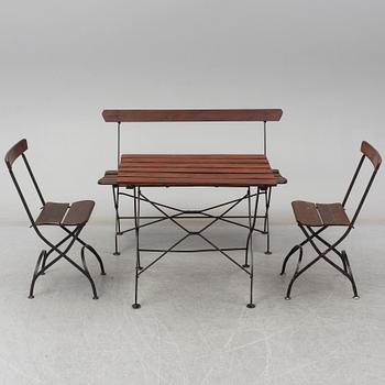 A garden sofa, table and a pair of chairs, first half of the 20th century.