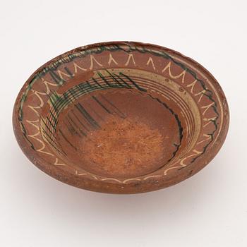 Two clay Swedish folk art dishes, 19th Century.