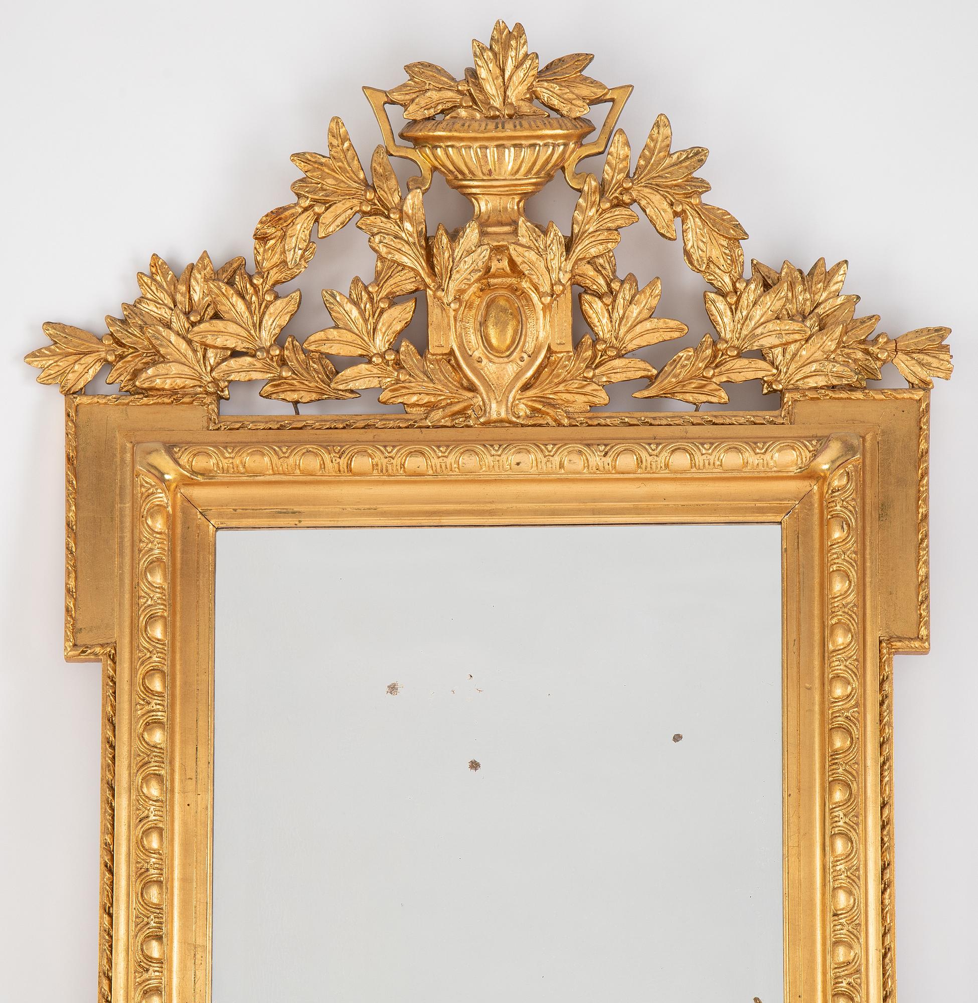 A mirror and console table from around the year 1900.