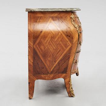 A rococo parquetry and gilt brass-mounted commode by J. J. Eisenbletter (active ca 1760-1810).