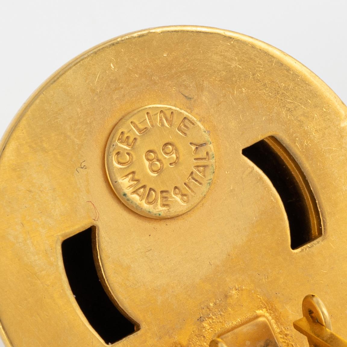 Céline, a pair of clip on earrings.