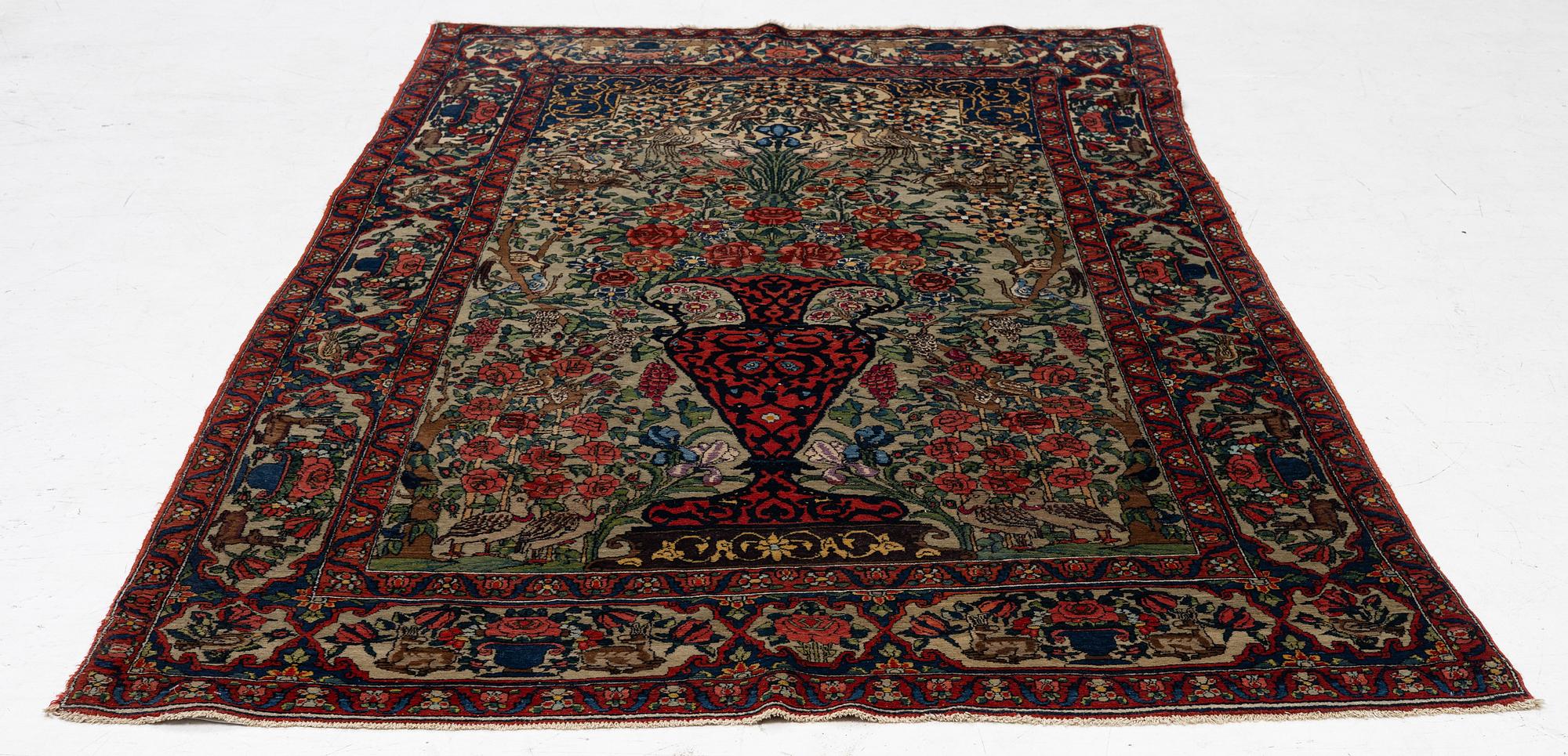 A figural oriental rug, c.. 230 x 130 cm.
