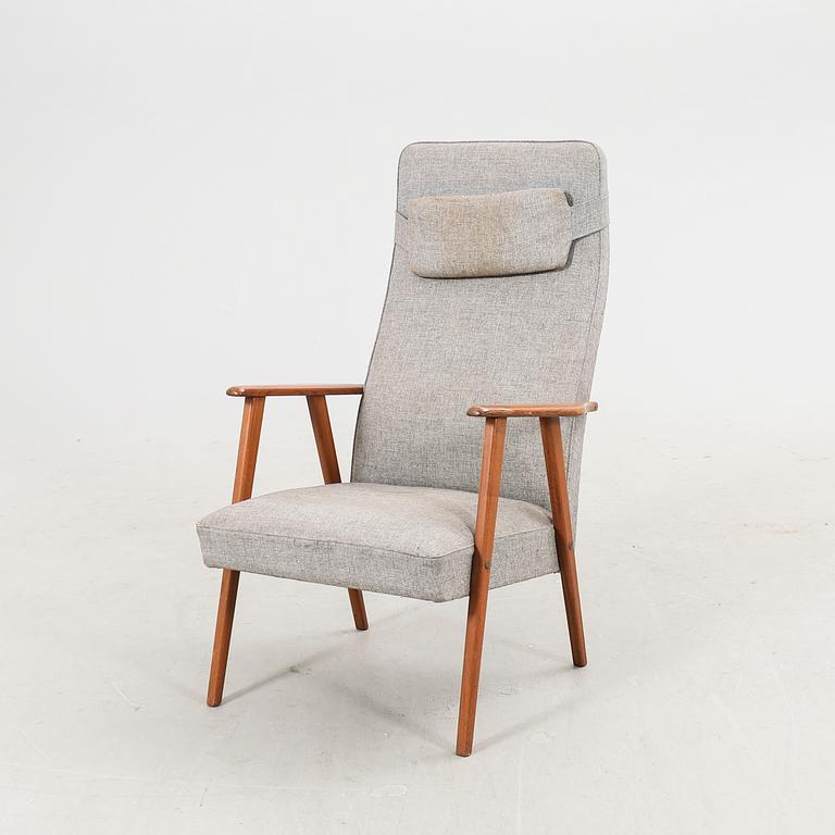 A 1960s teak armchair.