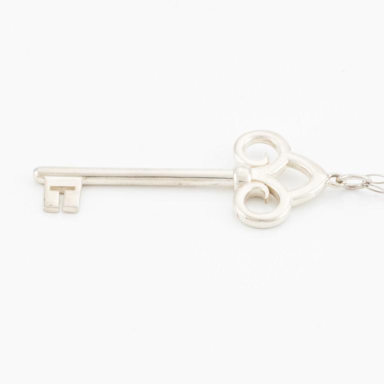 Tiffany & Co, "Fleur de lis key" pendant key with chain, sterling silver.