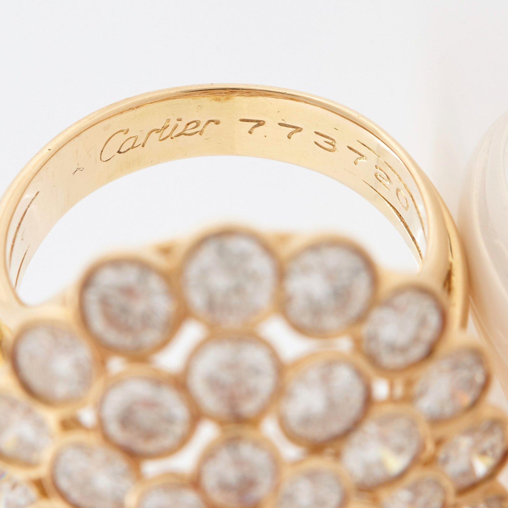 Cartier a ring in 18K gold set with round brilliant-cut diamonds.
