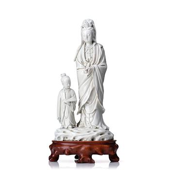 887. A blanc de chine figure of Guanyin and a servant, Qing dynasty, 19th Century.