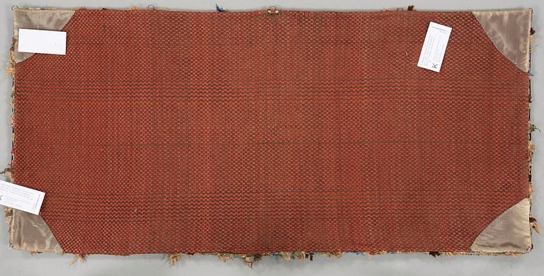 A CARRIAGE CUSHION. Tapestry weave. "Urnor och par". 48,5 x 101,5 cm. Southern Scania, Sweden, 19th century.