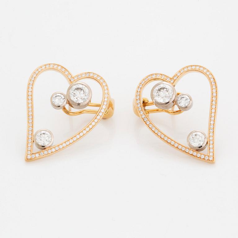 WA Bolin a pair of earrings in 18K gold and white gold set with round brilliant-cut diamonds.