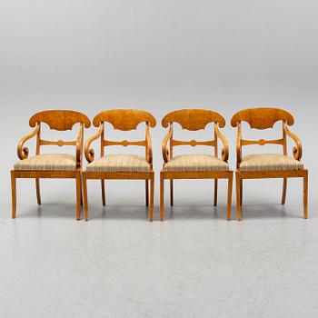 A Biedermeier table and four armchairs, mid 19th century.