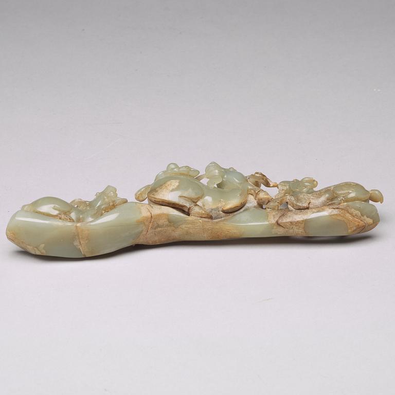 A Chinese nephrite sculpture of three rams.