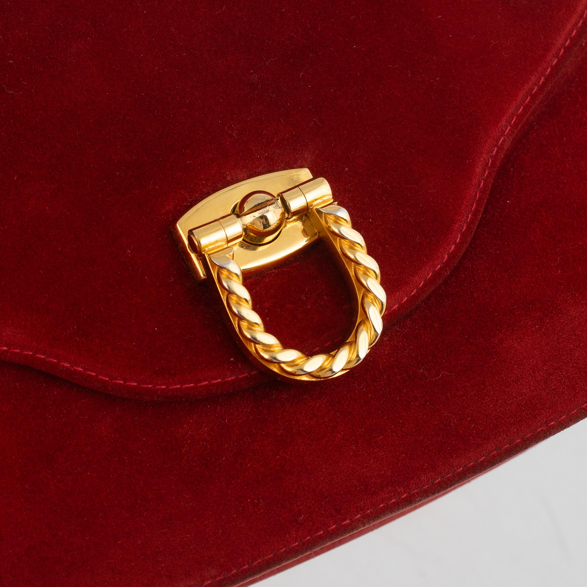 Gucci, a vintage suede bag.