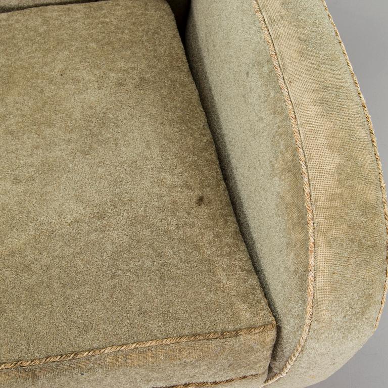 A pair of mid-20th century armchairs.