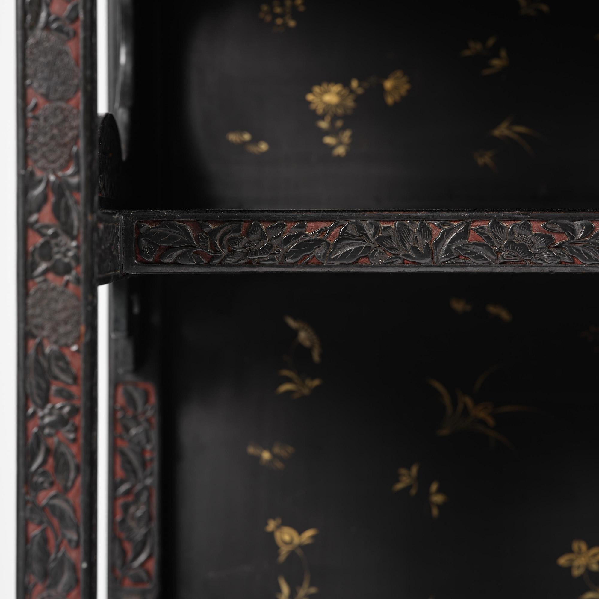 A lacquer display cabinet, late 19th century.