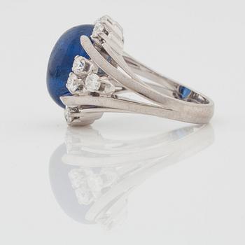 A circa 11.00 ct sapphire and brilliant cut diamond ring. Total carat weight of diamonds circa 1.00 ct.