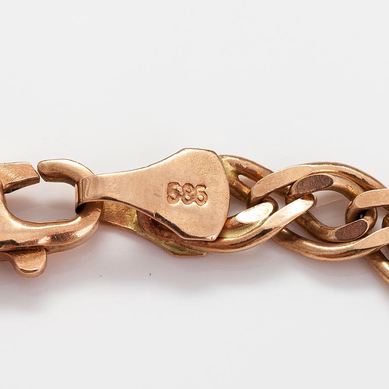 A 14K gold bracelet. Marked Midas.