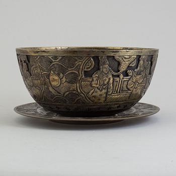 A Chinese brass bowl and Japanese dish, 20th century.