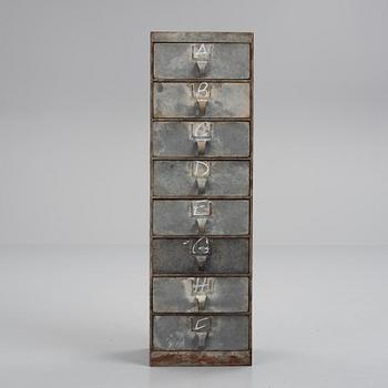 A contemporary metal chest of drawers.